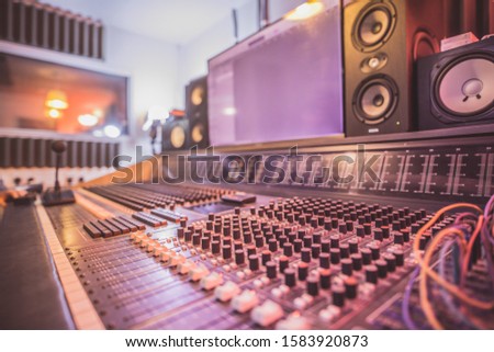 Recording music studio buttons and wires up close and colourful