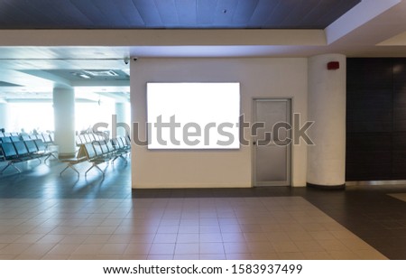 Mock up of light box in airport. Blank mock up light box template on wall display in Airport, Advertising banner Royalty-Free Stock Photo #1583937499