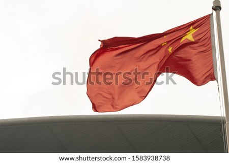 a chinese flag Drift in high rise roof 