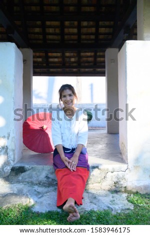 Thai woman with Lanna style background, Chiang Mai.
