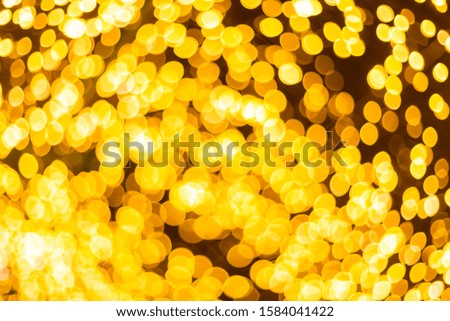 Yellow Colorful light Abstract circular bokeh of Christmas tree background Decoration During Christmas and New Year.