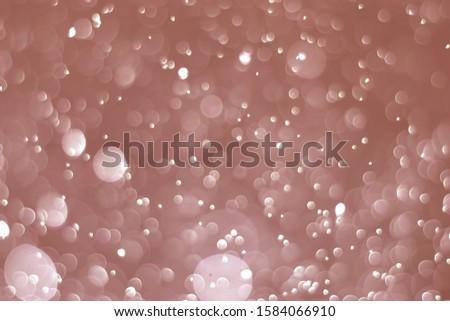Abstract bokeh lights with light Brown background
