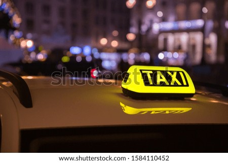 Taxi car cab somewhere on the street waiting for a passenger.