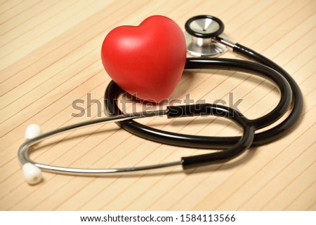 Medical Stethoscope, red heart isolated on background, photography, stock photo.
