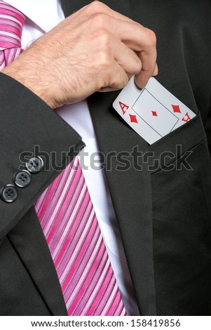 Businessman pulling out his pocket aces cards