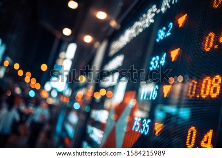 Financial stock market numbers and city lights