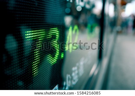 Financial stock market numbers and city lights