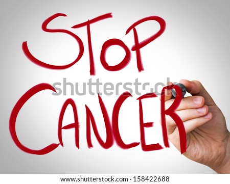 "Stop Cancer" Hand writing with red marker on transparent wipe board