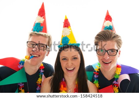 Identically adult male twins having birthday together with girl in studio
