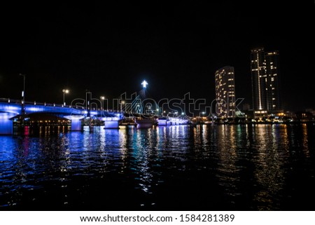 Cityscape of Da Nang city in Vietnam, with night illumination and modern buildings.