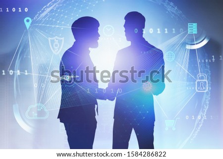 Two business partners shaking hands in blurry city with double exposure of big data interface. Concept of cloud computing and hi tech. Toned image