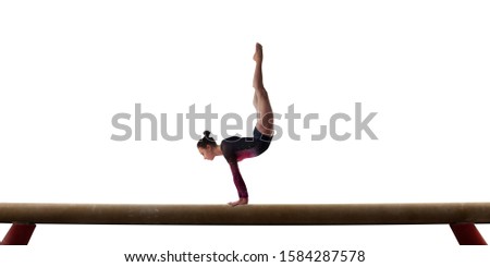 
Female gymnast doing a complicated trick on gymnastics balance beam isolated on white.