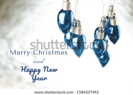 Classic blue color Pantone 2020 year Christmas bulb lights on a white background.