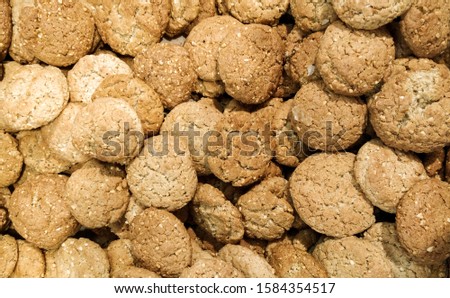 close-up of brown oatmeal cookies with sesame seeds texture