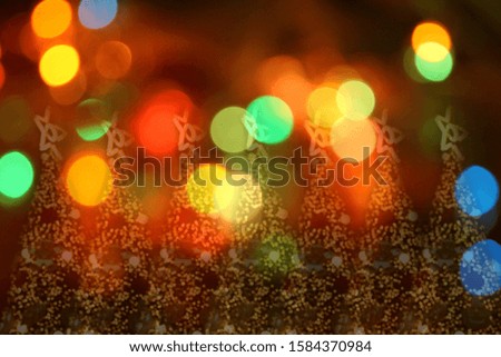 Abstract circular bokeh background of Christmaslight and Christmas tree background