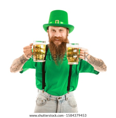 Bearded man with glasses of beer on white background. St. Patrick's Day celebration
