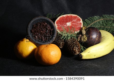 bowl with tobacco for hookah. fruits on a white background. smoking shisha