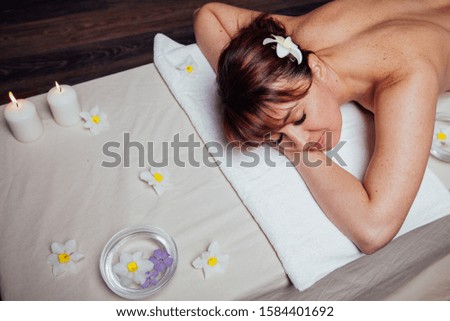 the beautiful girl lying in Spa massage sauna Royalty-Free Stock Photo #1584401692