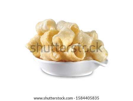 Fried and Spicy Tasty yellow salted pipe, Masala Cherry Ball Sncaks, Most famous and delicious wheat flour snack Children love them very much Snacks or Fryums (Snacks Pellets) served in a white bowl. Royalty-Free Stock Photo #1584405835