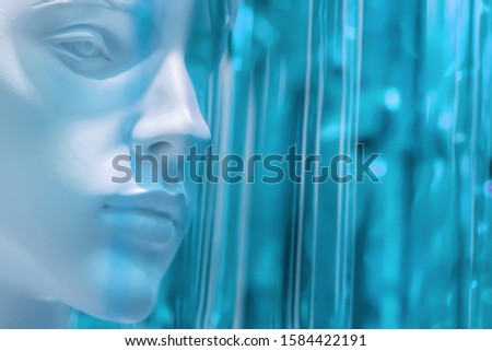 stylish beauty female mannequin head on a blurred colored light green, green, light blue, background, light tinting. Good blank layout for fashion close-up, copyspace. defocused.