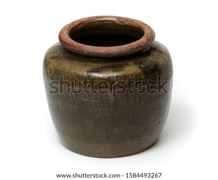 Small brown earthen jar isolated Object stock photo