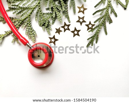 Stethoscope and Christmas decorations. Medical concept. Greeting card. New Year and Christmas.