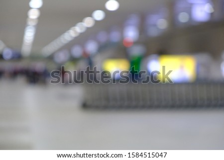 blurred picture of passengers walking in the airport