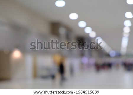 blurred picture of passengers walking in the airport