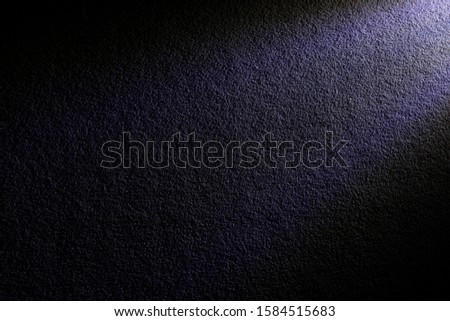 dark stylish textured surface with projector light and shadow frame wallpaper background concept mock up pattern for commerce advertising picture with empty copy space for your text here 
