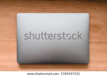 Conceptual workspace, Laptop computer with blank white screen on table, blurred background. use in Traditional Chinese Alphabet operating system.