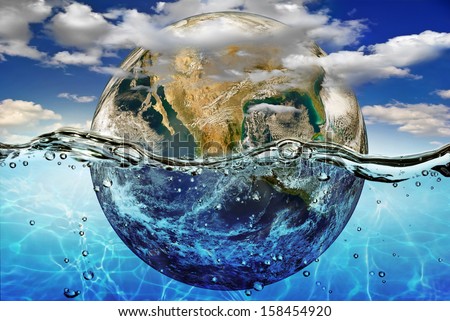 Earth is immersed in water, among the clouds against the sky."Elements of this image furnished by NASA" Royalty-Free Stock Photo #158454920