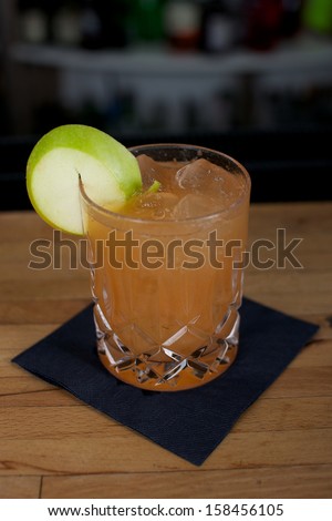 Picture of a fresh cocktail on a bar desk
