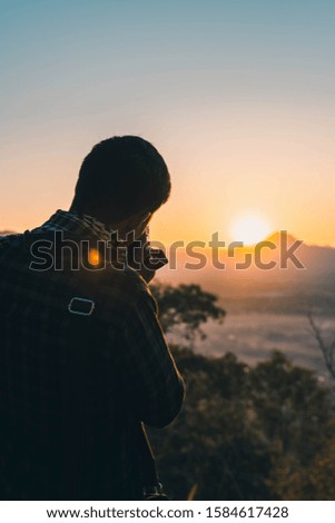 Photographing the sunrise On the mountains in Thailand
