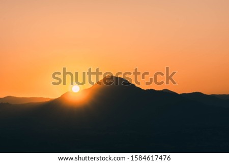 Photographing the sunrise On the mountains in Thailand
