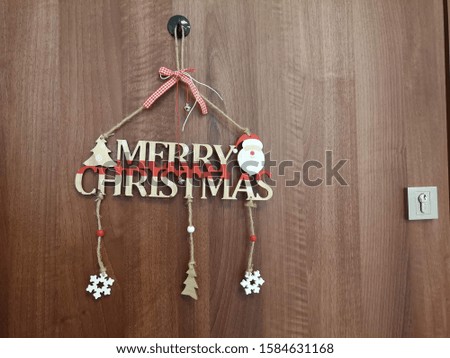 Wish merry christmas. This is a door decoration.
