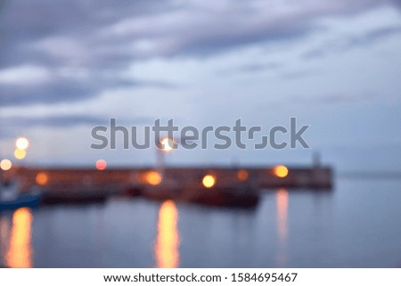 Night view of a fishing port in the north of Spain. out of focus image for background. concept tourism and night