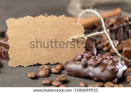Appetizing food background. Sweets and coffee beans around the card for notes. 
