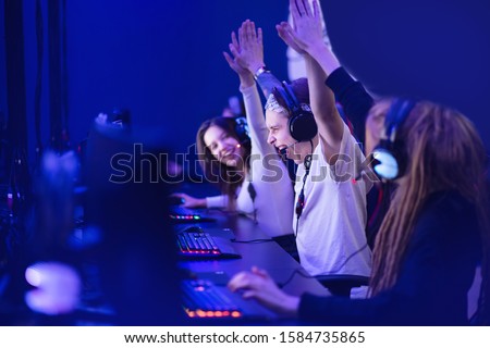 Team professional gamer playing winning tournaments online games computer. Royalty-Free Stock Photo #1584735865