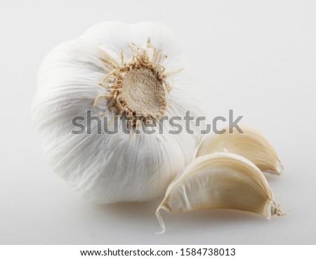 Close-Up Of Garlic Clove Against White Background