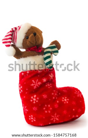 Teddy bear stuffed in stocking waiting for some good little boy or girl to find him on Christmas morning.