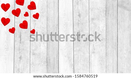 Red hearts for Valentine's day on a white wooden background, copy space
