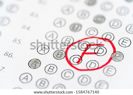 Answer sheet and red F grade. Bad test results in school, university Royalty-Free Stock Photo #1584767140