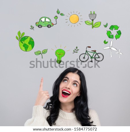 Eco theme with happy young woman on a gray background
