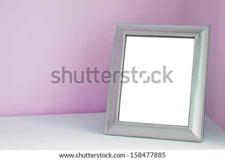 Blank picture frame at the desk  
