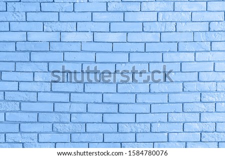 Grunge brick wall texture, copy space. Classic blue background. Color of the year 2020. Top view, flat lay