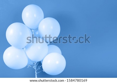 Classic blue background with bunch of flying balloons, copy space for text. Color of the year 2020. Christmas, birthday, valentine, wedding, holiday concept