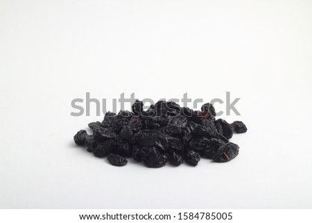 black raisins isolated on a white background