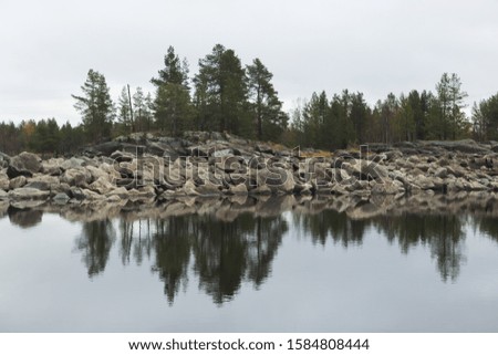 Coast of White sea with mirror of the water