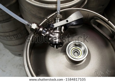 Beer keg, s-type connector and s-type keg disconnected Royalty-Free Stock Photo #1584817105