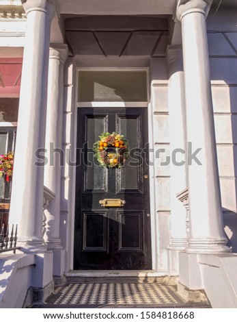 Notting hill, vintage house entrance door Christmas decorated, London United Kingdom